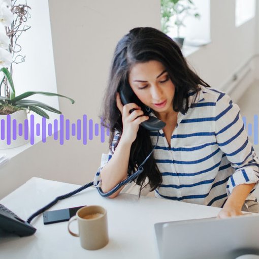 Photo of a woman in an office talking on her desk phone while typing on her computer. In the background, a series of small vertical purple-gradient lines run across the screen.