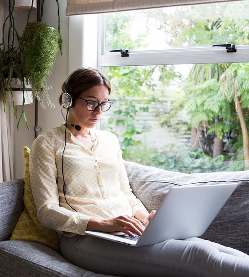 Extra help on Desktop Girl using laptop to work from home